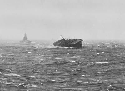 USS Langley (CVL-27) rolling sharply during extreme weather conditions